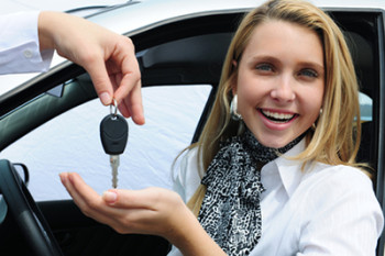 happy woman receiving car key