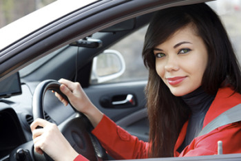 Pretty brunette driving a car