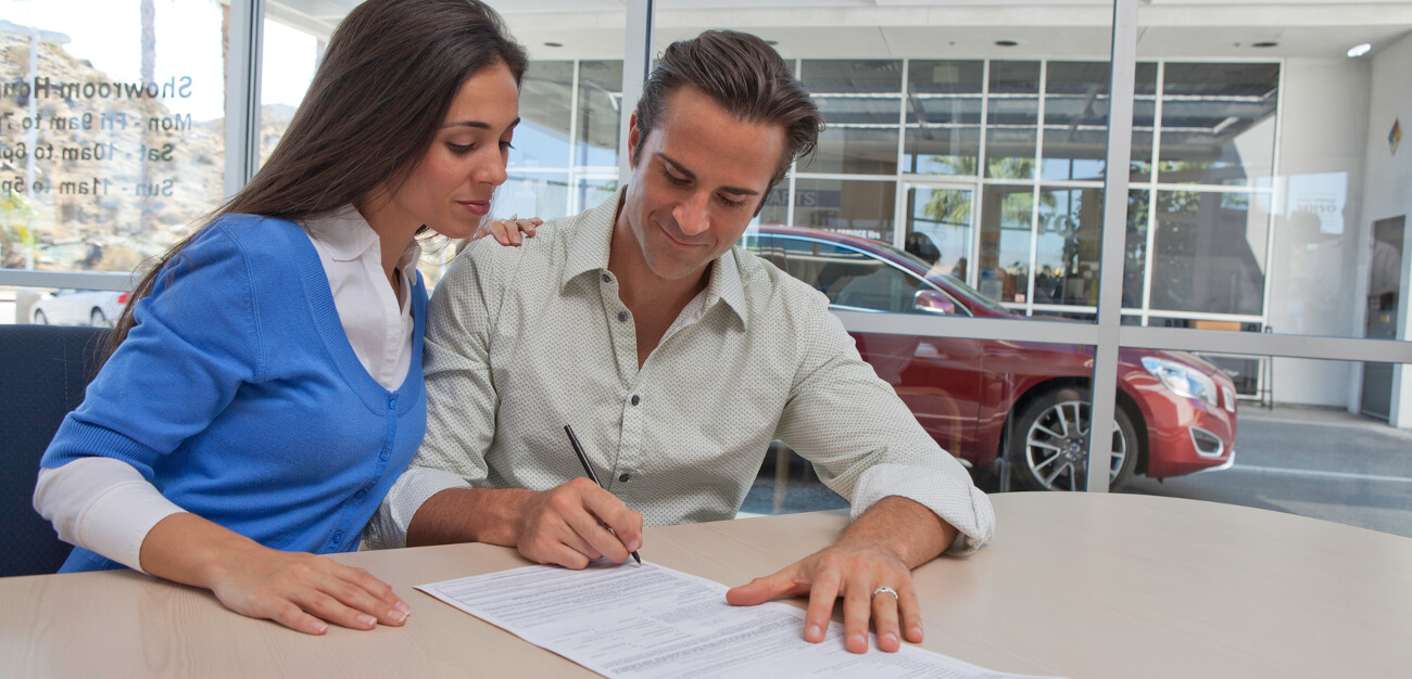 couple signing finance papers